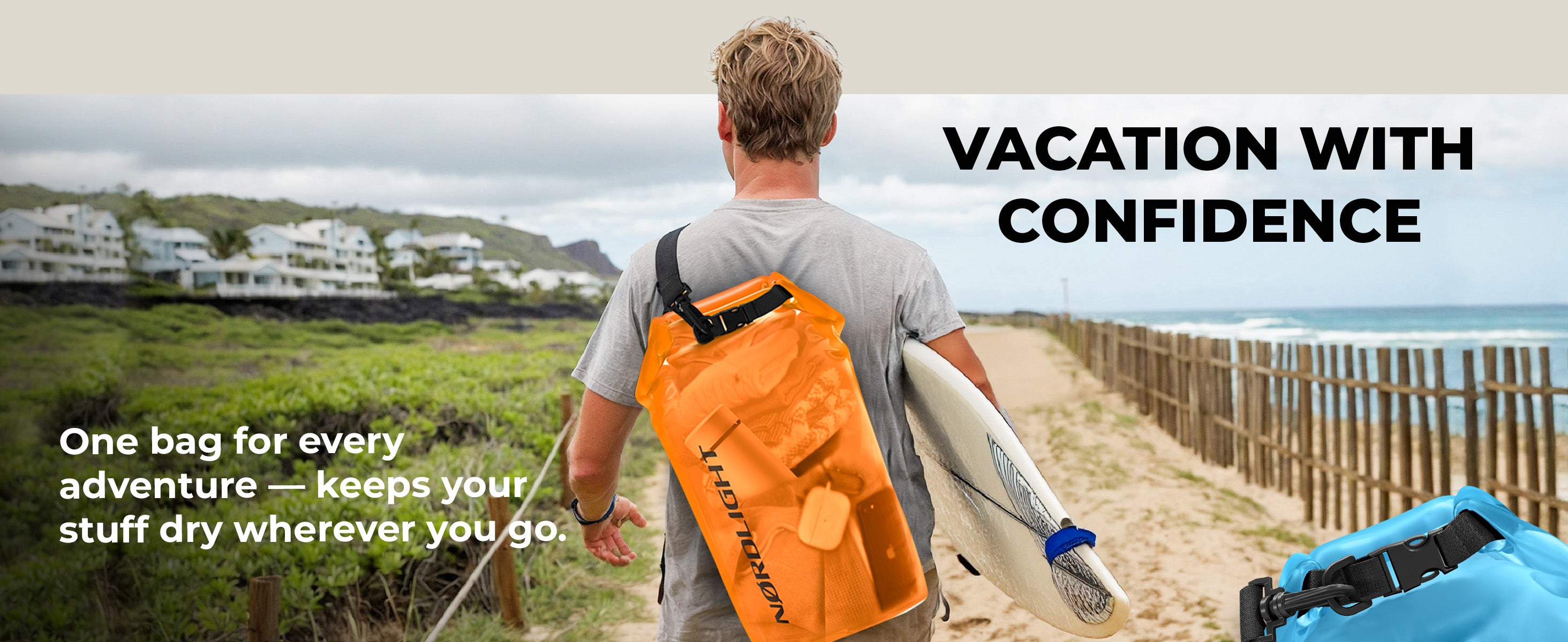 Surfer carrying an orange Nordlight Dry Bag on his back, heading toward the waves.
